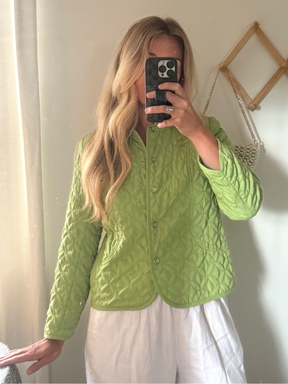 Green quilted jacket with button up front